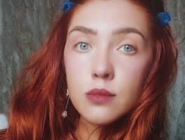 Join Ukrainian cam model Regimasmile as she dances to traditional music