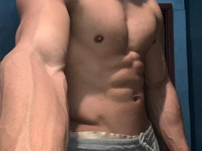 Tanned and toned muscular man veilofstrength online now